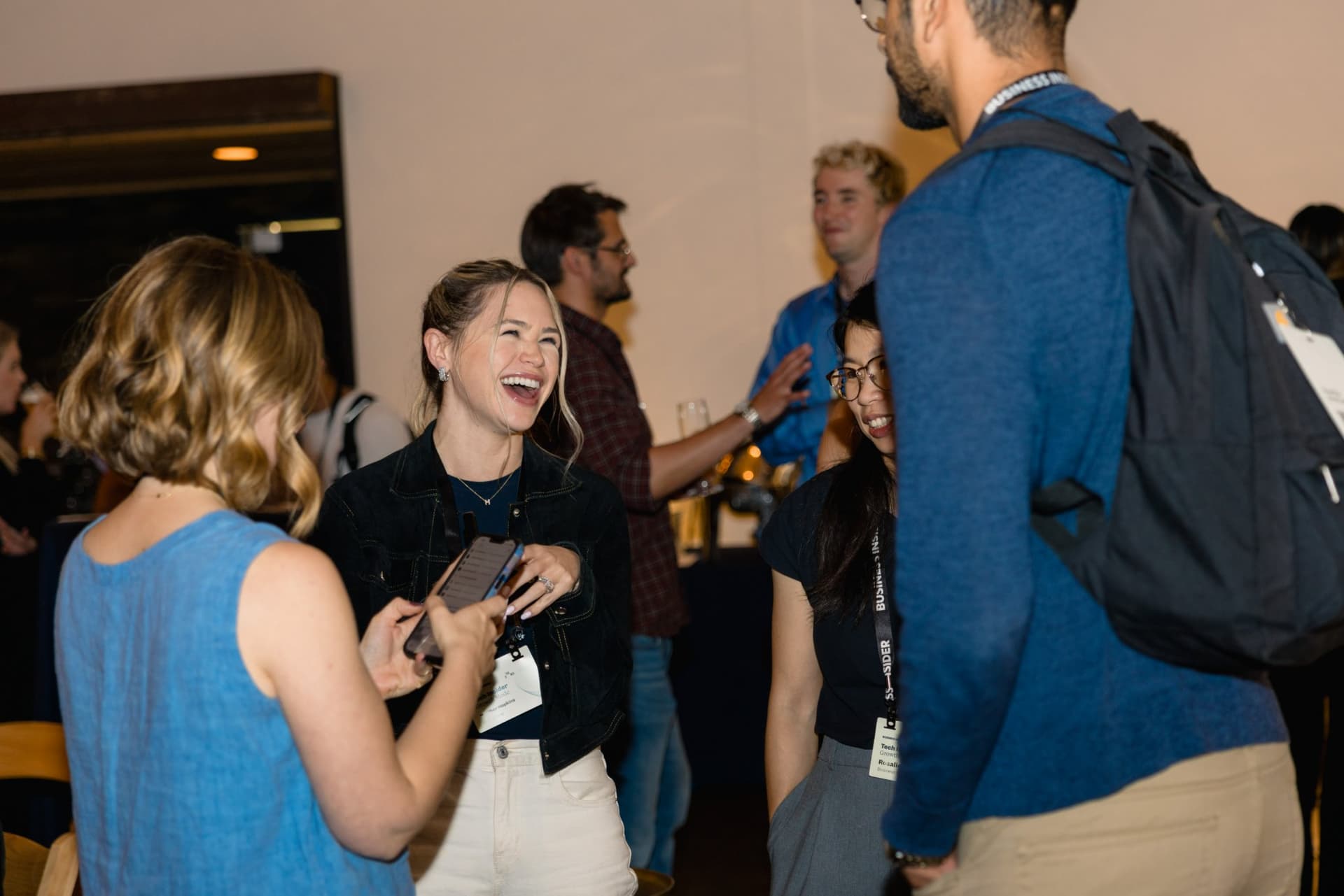 Attendees laughing together during the networking reception at Business Insider Tech Insider: Growth Mode at The Pearl SF during SF Tech Week 2026 in San Francisco by JY Studio