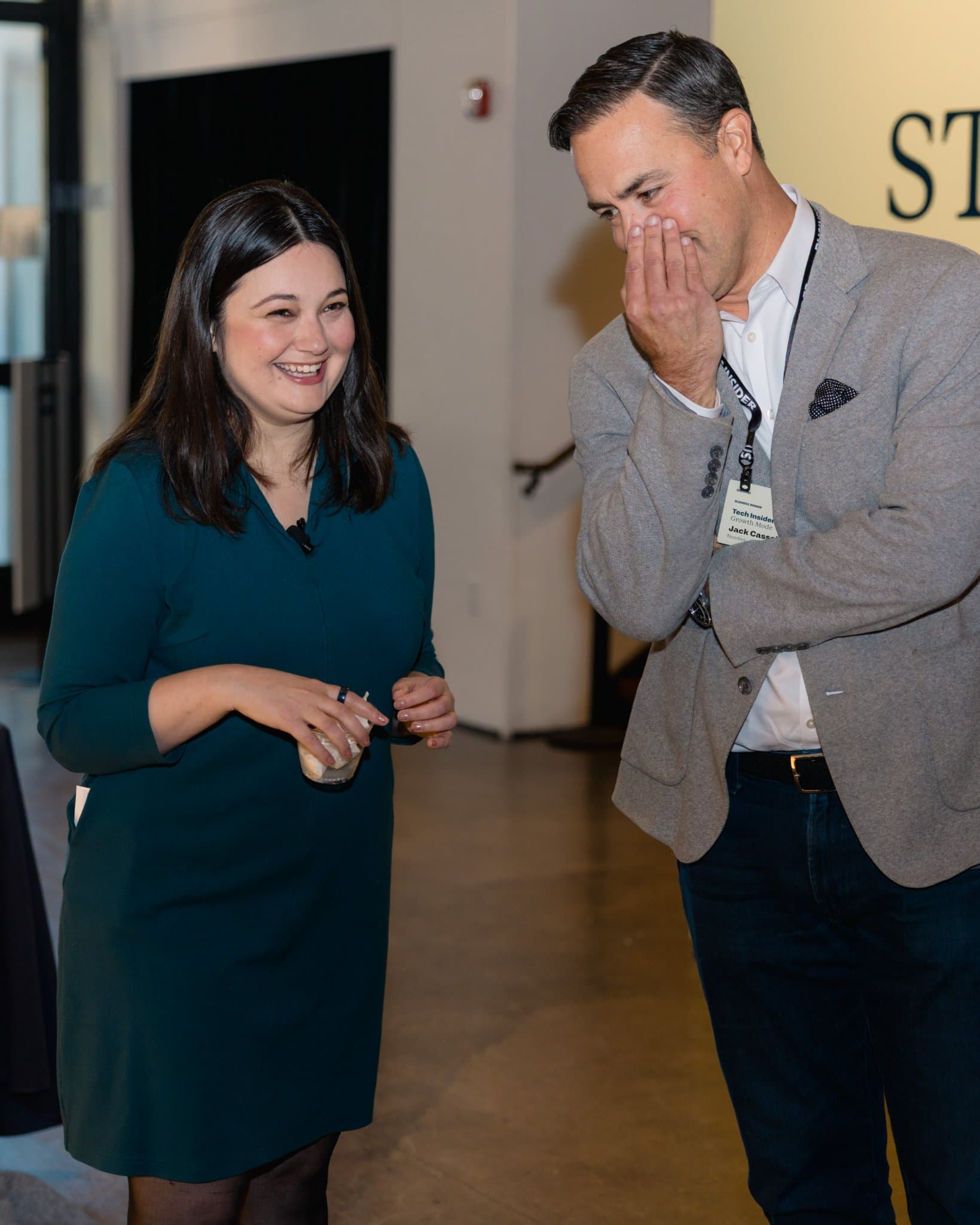 Business Insider's Katie Roof laughing with an attendee during the reception at Business Insider Tech Insider: Growth Mode at The Pearl SF during SF Tech Week 2026 in San Francisco by JY Studio