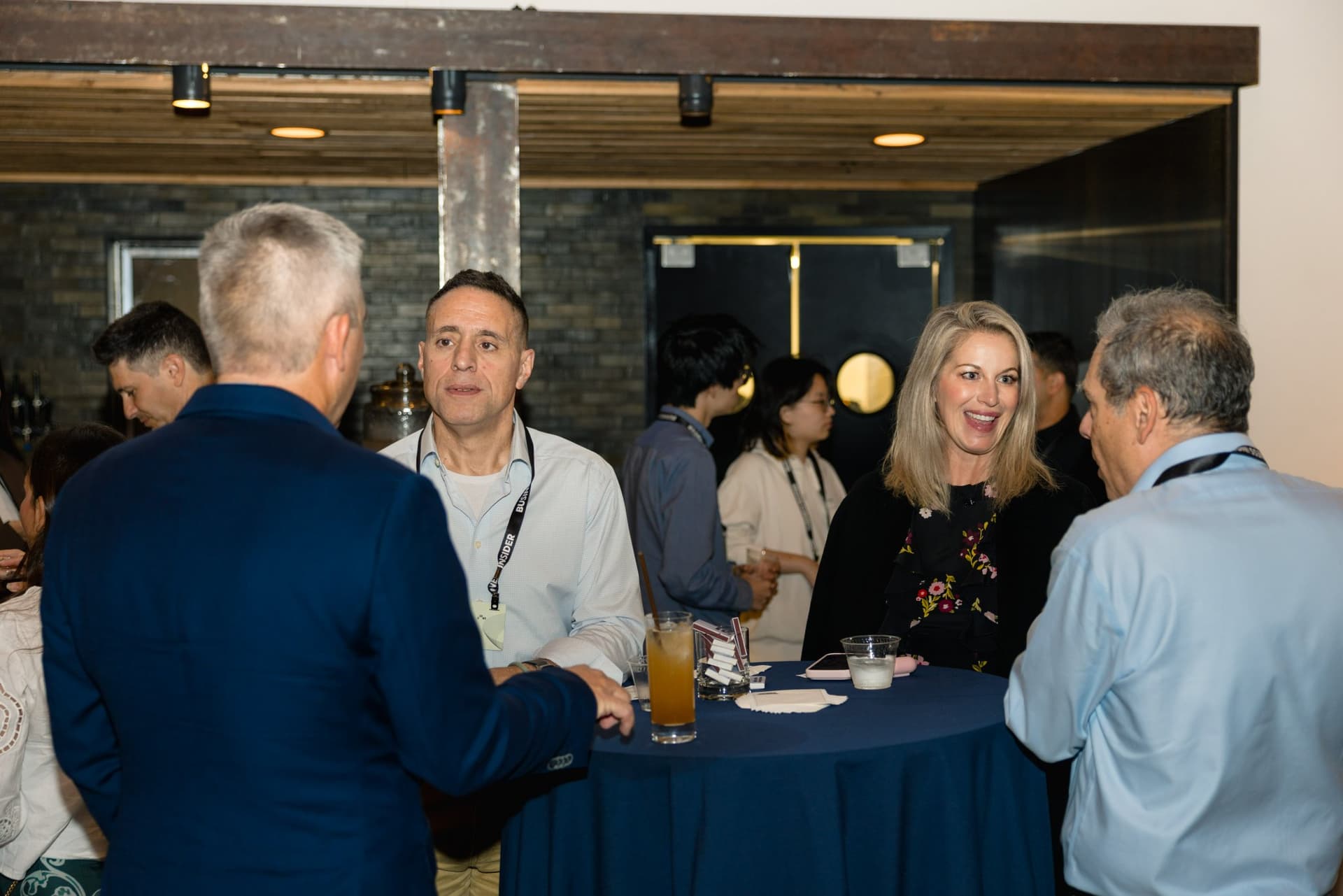 Attendees talking at a cocktail table during the reception at Business Insider Tech Insider: Growth Mode at The Pearl SF during SF Tech Week 2026 in San Francisco by JY Studio