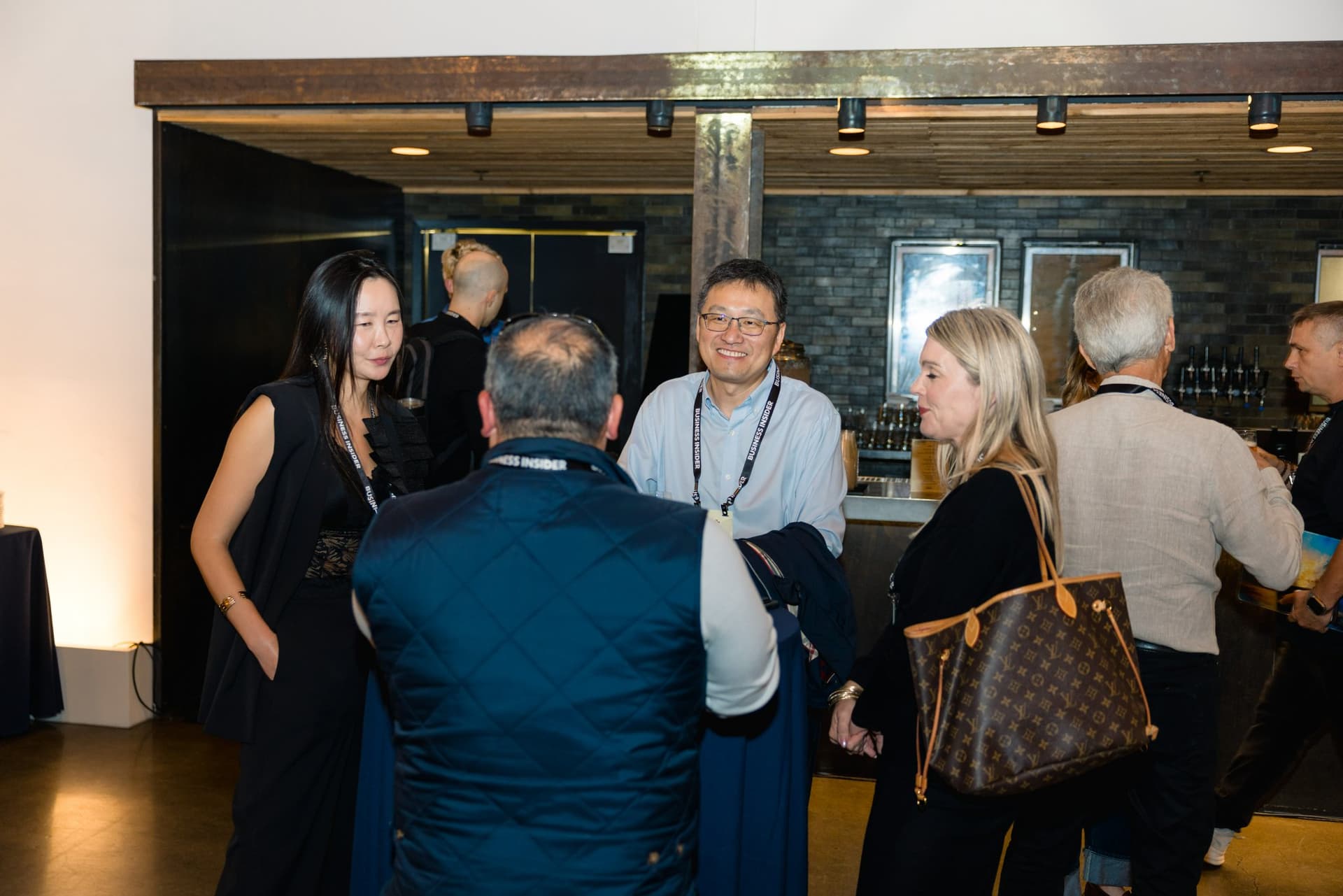 Attendees mingling near the bar at Business Insider Tech Insider: Growth Mode at The Pearl SF during SF Tech Week 2026 in San Francisco by JY Studio