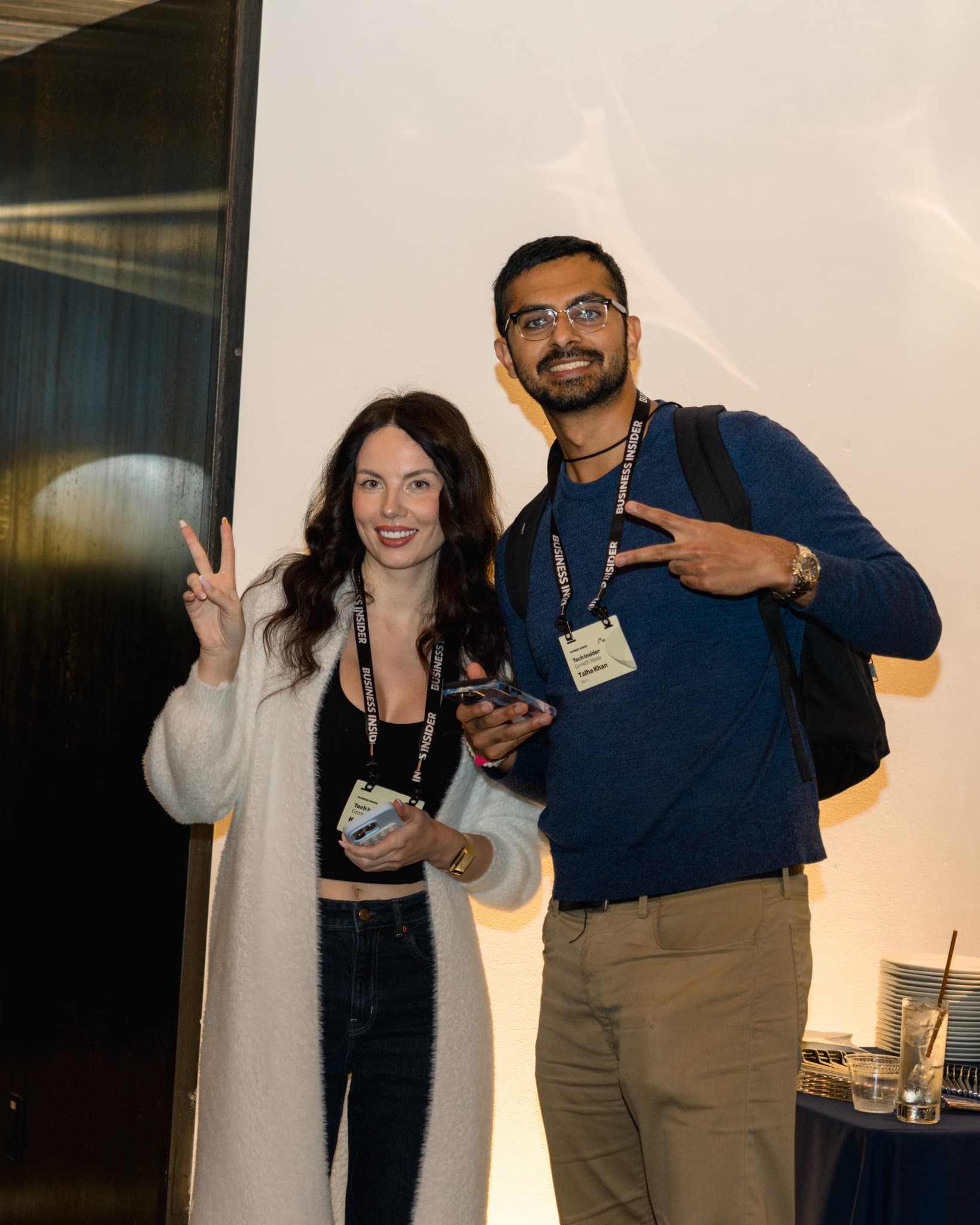 Two attendees posing with peace signs at Business Insider Tech Insider: Growth Mode at The Pearl SF during SF Tech Week 2026 in San Francisco by JY Studio