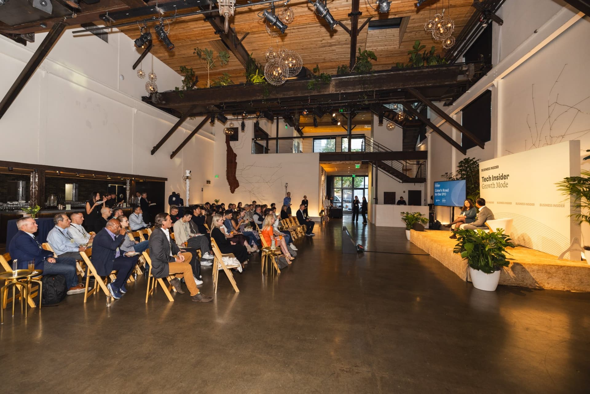 Wide view of the audience facing the stage during a session at Business Insider Tech Insider: Growth Mode at The Pearl SF during SF Tech Week 2026 in San Francisco by JY Studio