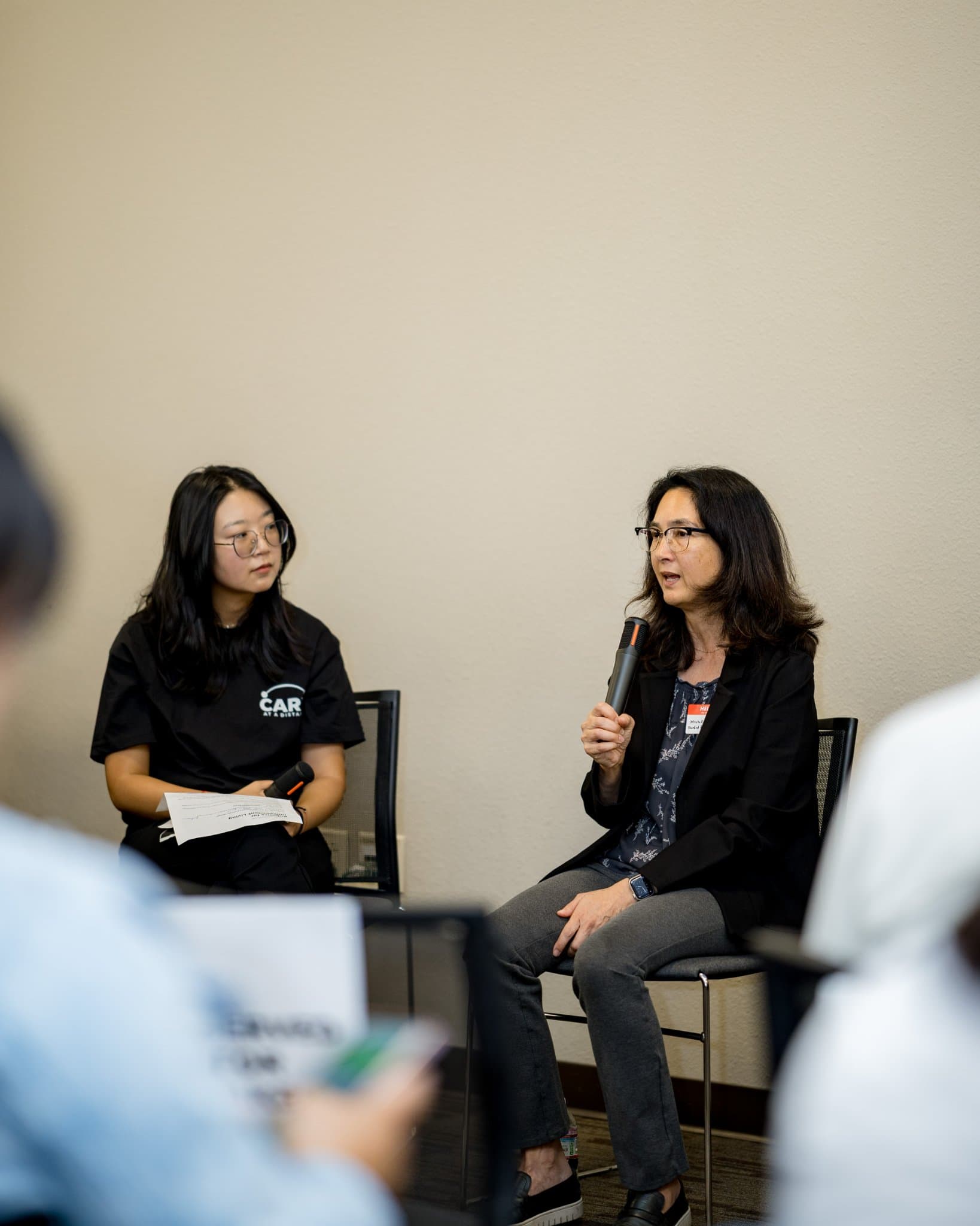 Moderator and Stanford researcher in conversation during Panel 2 "Robotics for Independent Living" at Care at a Distance: AI, Sensors, Robotics and the Future of Aging, SF Tech Week 2026 at EVGR, Stanford University by JY Studio