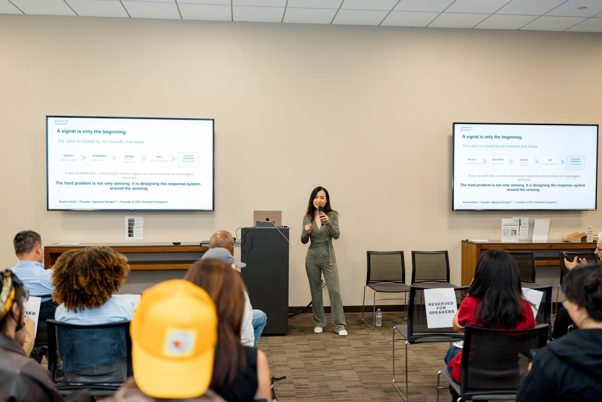 Short talk speaker presenting "A signal is only the beginning" between the two panels at Care at a Distance: AI, Sensors, Robotics and the Future of Aging, SF Tech Week 2026 at EVGR, Stanford University by JY Studio