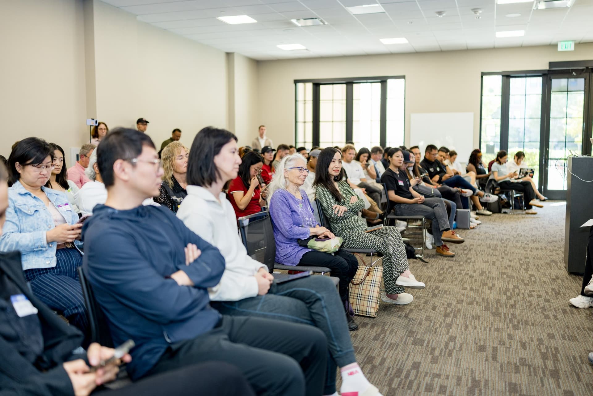 Attendees listening during the robotics for independent living panel at Care at a Distance: AI, Sensors, Robotics and the Future of Aging, SF Tech Week 2026 at EVGR, Stanford University by JY Studio