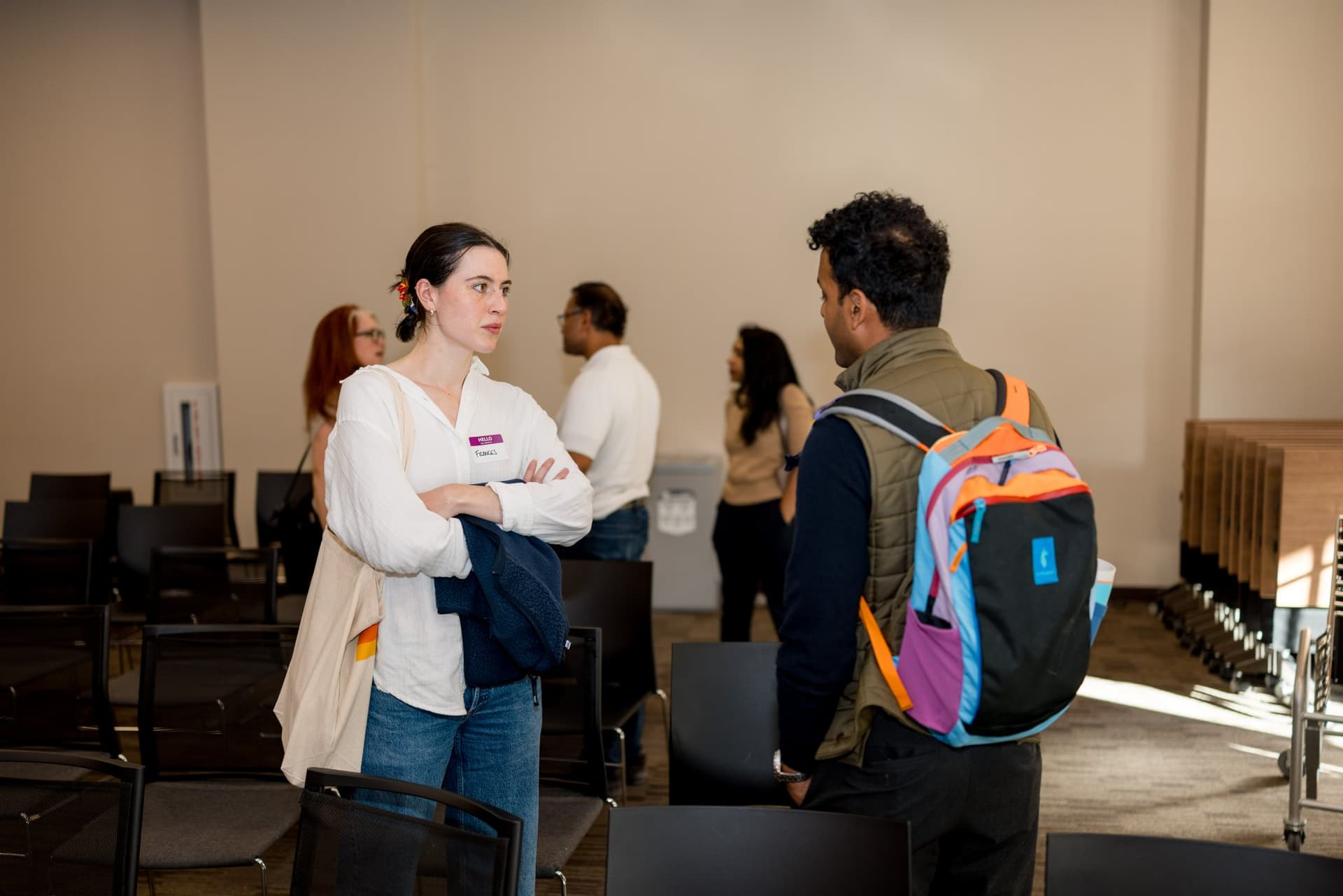 Attendees talking during networking after the panels at Care at a Distance: AI, Sensors, Robotics and the Future of Aging, SF Tech Week 2026 at EVGR, Stanford University by JY Studio