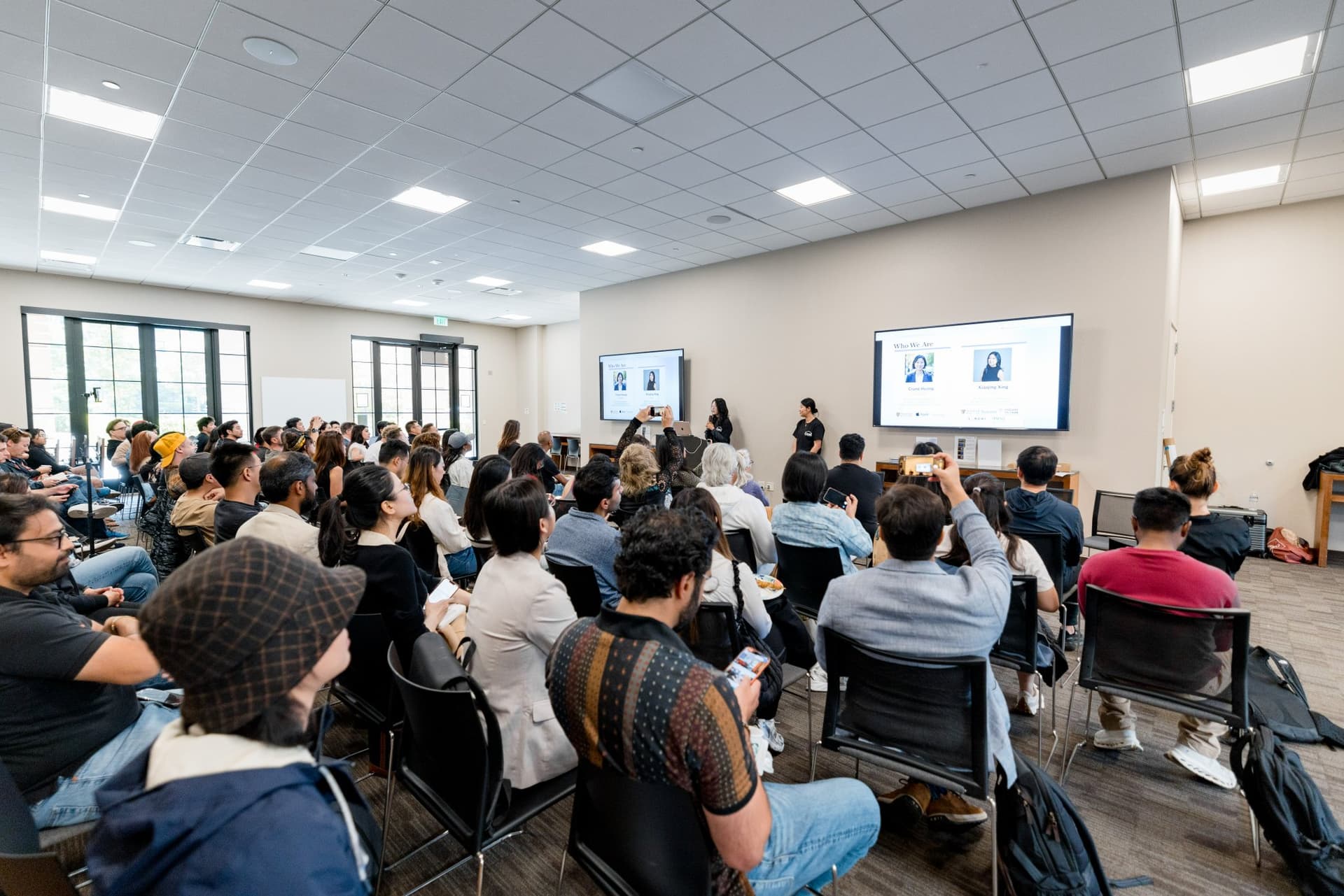 Wide view of the room filled with attendees at Care at a Distance: AI, Sensors, Robotics and the Future of Aging, SF Tech Week 2026 at EVGR, Stanford University by JY Studio