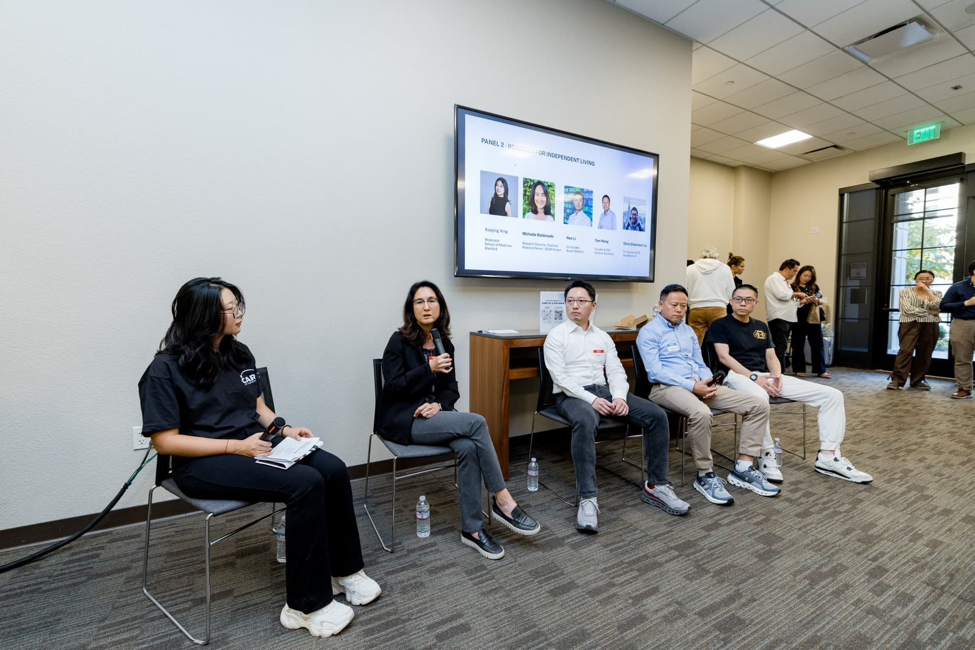 Moderators and panelists of Panel 2 "Robotics for Independent Living" seated together at Care at a Distance: AI, Sensors, Robotics and the Future of Aging, SF Tech Week 2026 at EVGR, Stanford University by JY Studio
