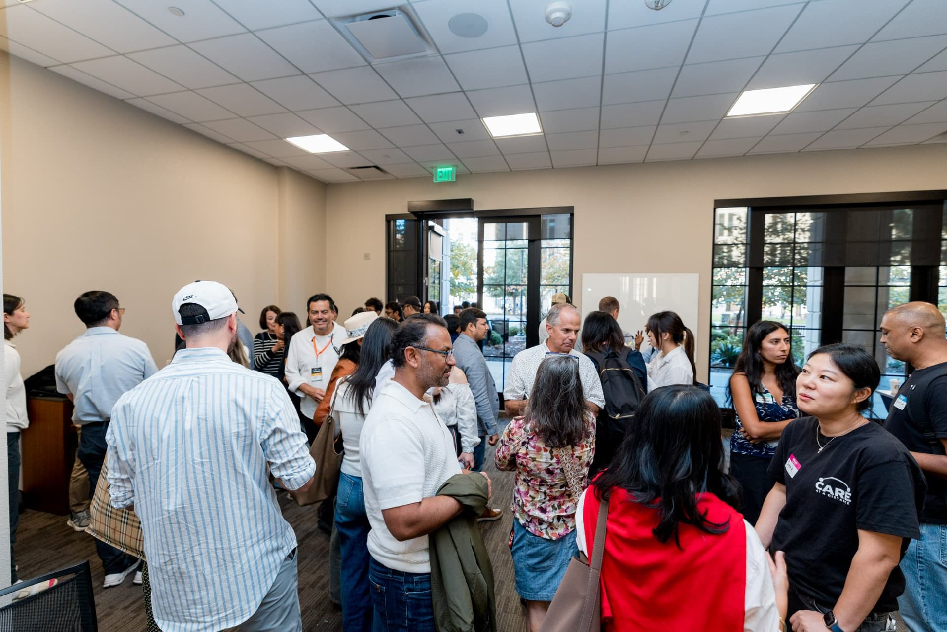 Crowd of attendees networking after the program at Care at a Distance: AI, Sensors, Robotics and the Future of Aging, SF Tech Week 2026 at EVGR, Stanford University by JY Studio