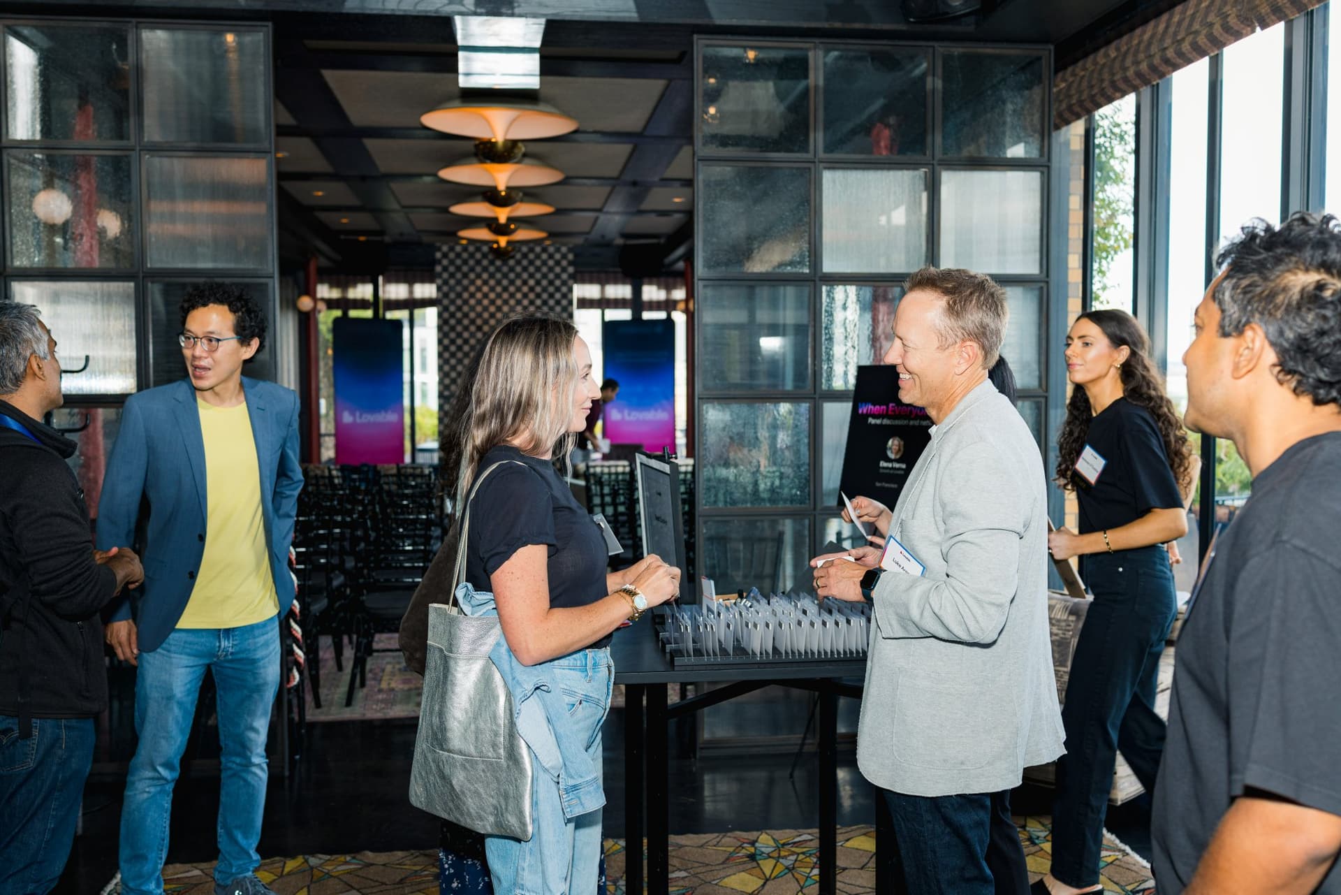 Guests mingling near the entrance during the reception at Lovable's When Everyone Can Build panel in San Francisco by JY Studio