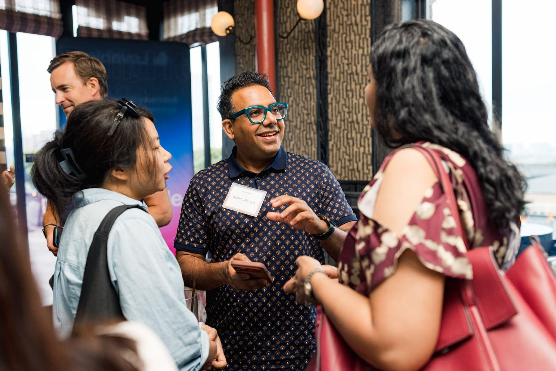 Guests swapping stories during the networking reception at Lovable's When Everyone Can Build panel in San Francisco by JY Studio