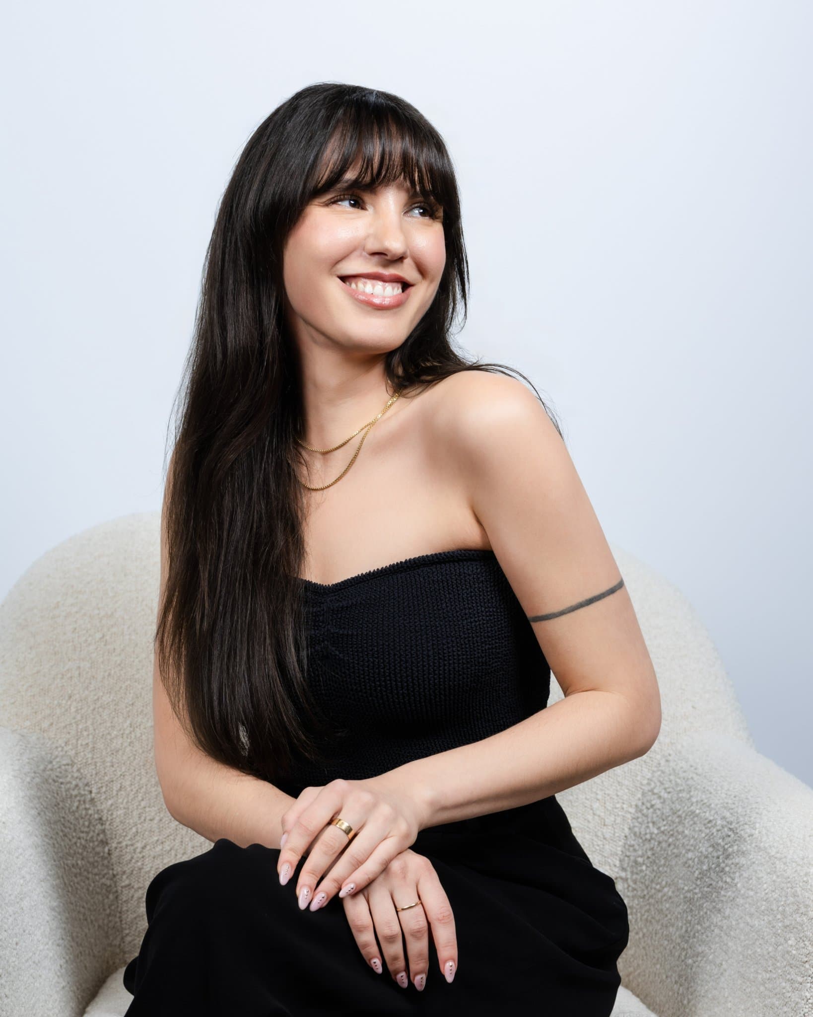 Abaka AI seated editorial-style corporate portrait in a cream boucle chair, on-site headshot session in Mountain View Silicon Valley for team page and press kit by JY Studio