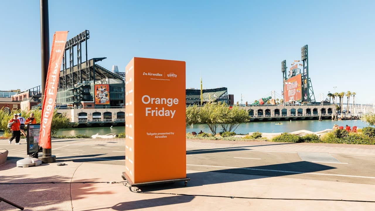 Guest getting her face painted at the Airwallex x SF Giants Orange Friday tailgate at Mission Rock, San Francisco, filmed by JY Studio